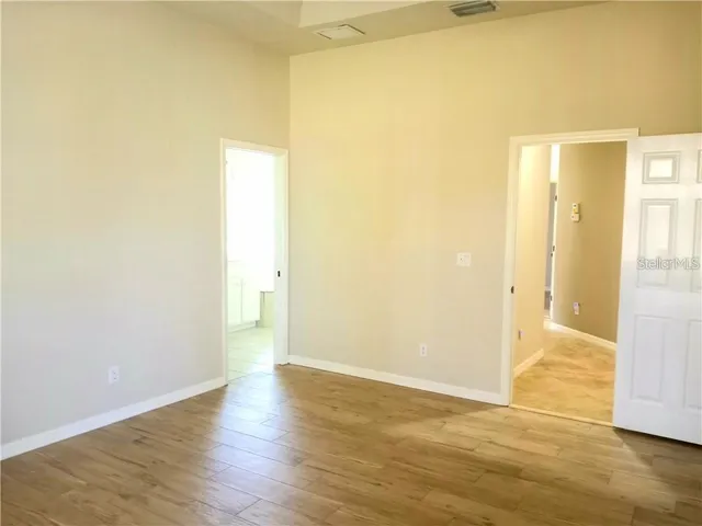 a view of a bathroom with wooden floor