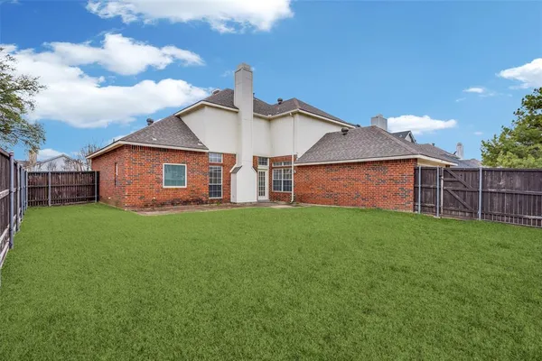 a backyard of a house with lots of green space