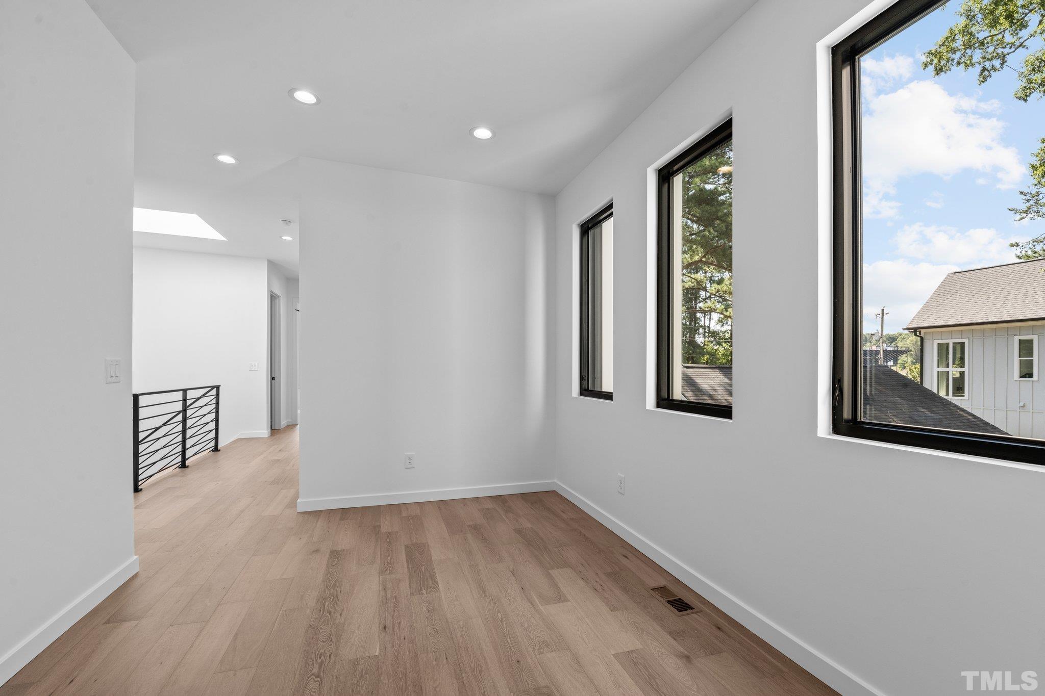 907 North State Street, Unit 101 Raleigh, NC 27604 - Photo 25 of 58 a view of an entryway with wooden floor and windows