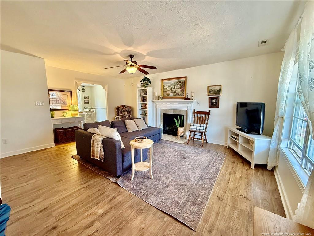 234 Pender Road Spring Lake, NC 28390 - Photo 4 of 39 a living room with furniture and a fireplace