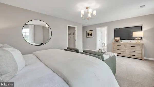 a bedroom with a bed and a night stand