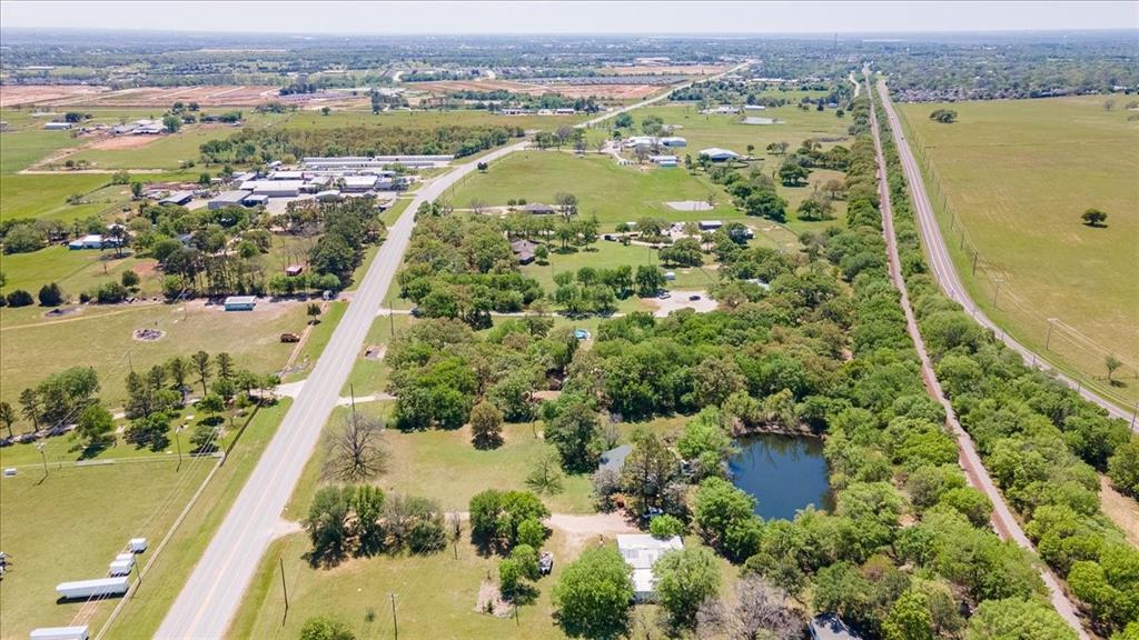 8293 Highway 377 Pilot Point, TX 76258 - Photo 7 of 14 an aerial view of residential houses with outdoor space