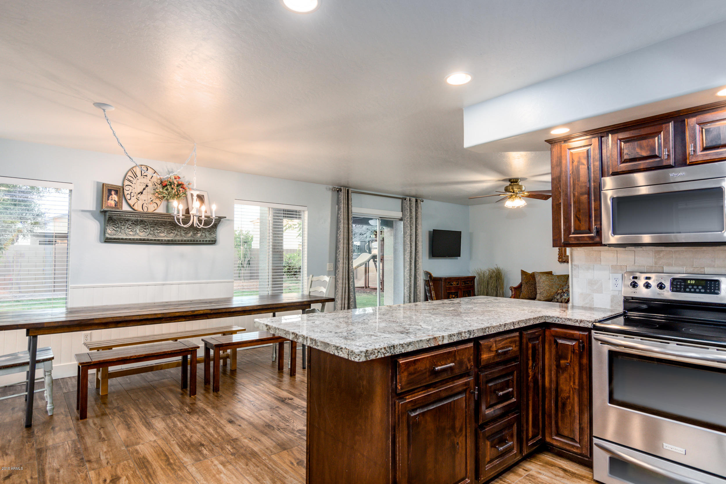 2644 East Del Rio Street Gilbert, AZ 85295 - Photo 11 of 42 a kitchen with a stove a sink and a refrigerator