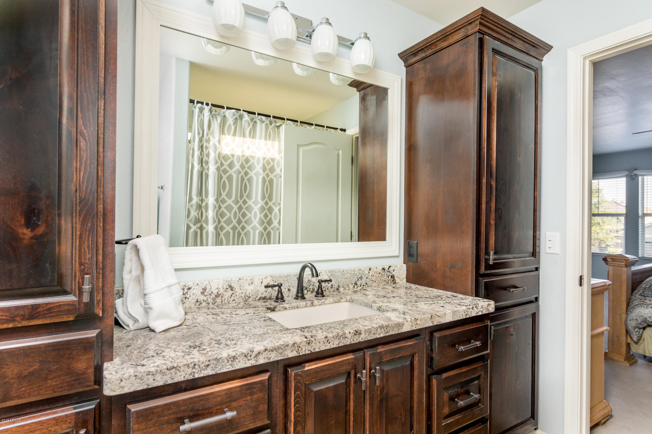 2644 East Del Rio Street Gilbert, AZ 85295 - Photo 21 of 42 a bathroom with a granite countertop sink and a mirror