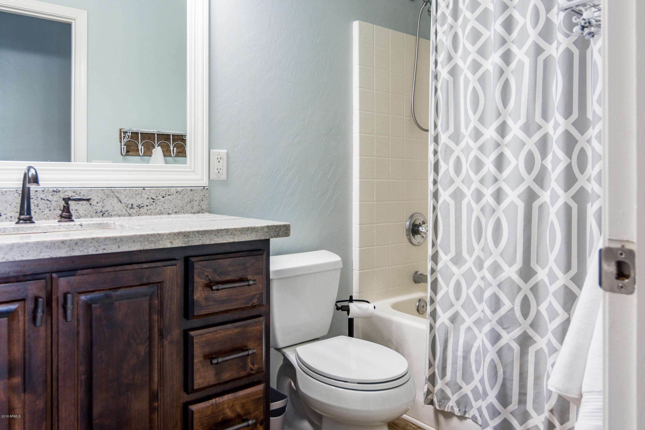 2644 East Del Rio Street Gilbert, AZ 85295 - Photo 29 of 42 a bathroom with a sink a toilet and shower curtain