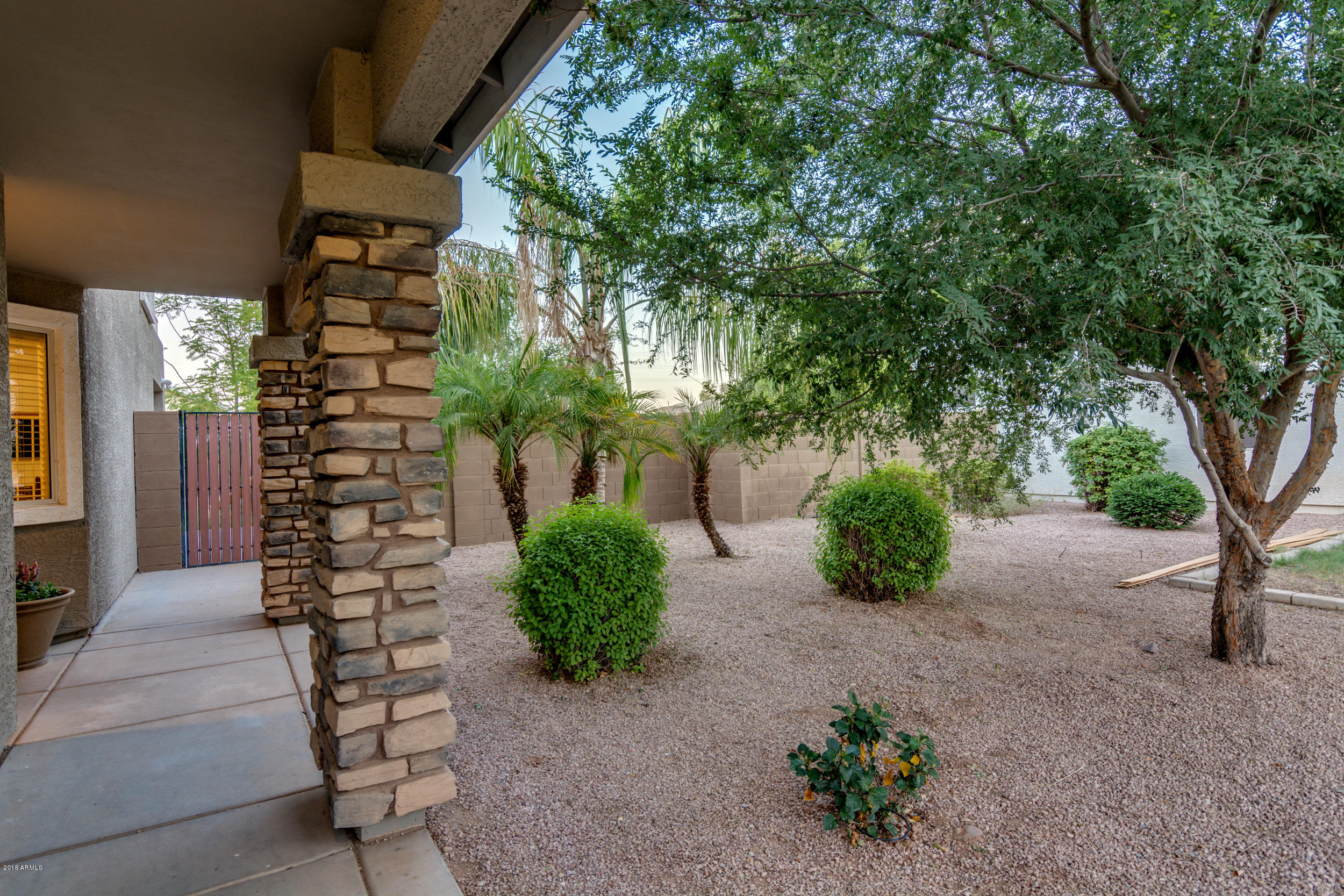 2644 East Del Rio Street Gilbert, AZ 85295 - Photo 3 of 42 a view of a pathway with flower plants