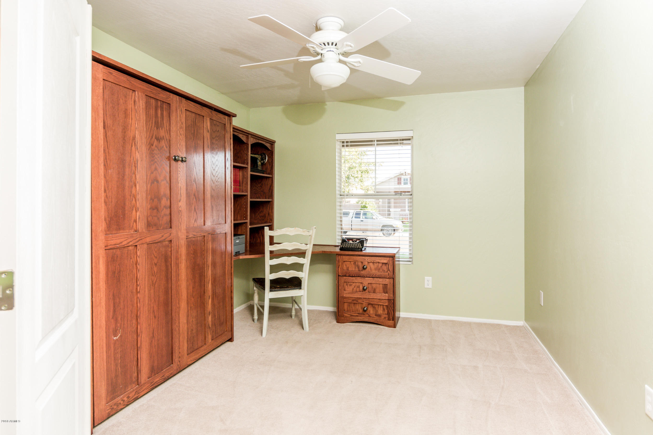 2644 East Del Rio Street Gilbert, AZ 85295 - Photo 31 of 42 an empty room with furniture and a window