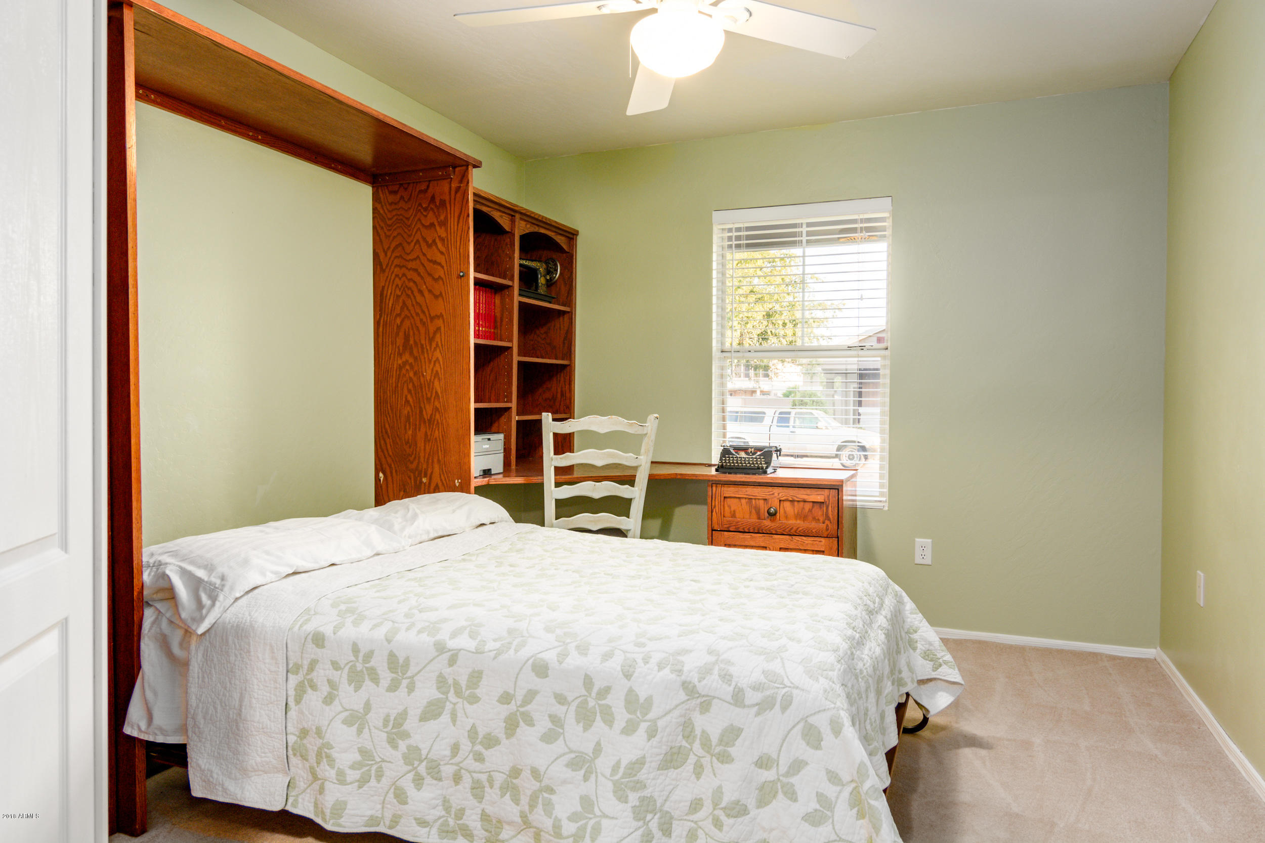 2644 East Del Rio Street Gilbert, AZ 85295 - Photo 32 of 42 a bed sitting in a bedroom next to a window