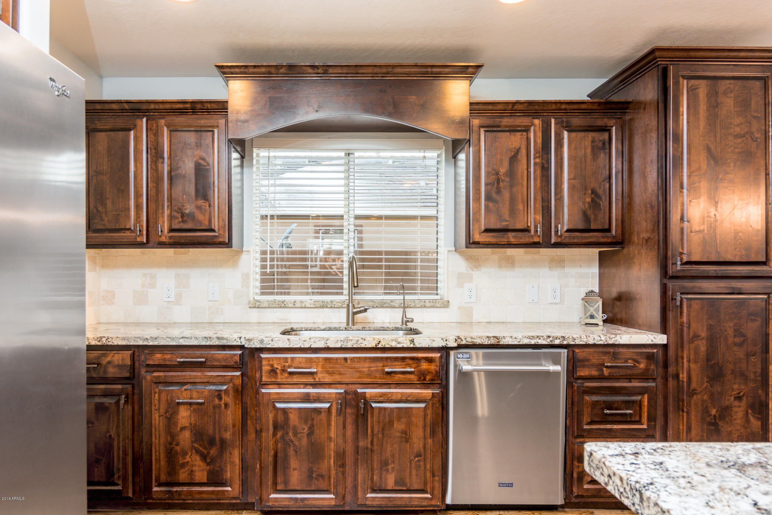 2644 East Del Rio Street Gilbert, AZ 85295 - Photo 9 of 42 a kitchen with stainless steel appliances granite countertop a refrigerator and a stove top oven