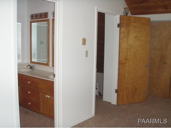 2895 North Reed Road, Unit 1 Chino Valley, AZ 86323 - Photo 13 of 22 a bathroom with a sink and mirror