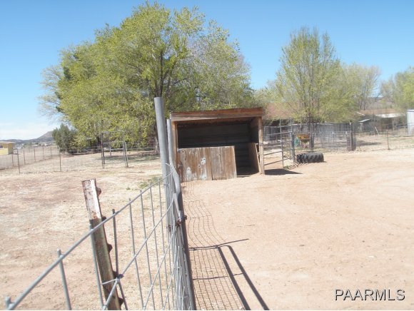 2895 North Reed Road, Unit 1 Chino Valley, AZ 86323 - Photo 22 of 22 a view of a backyard with wooden fence