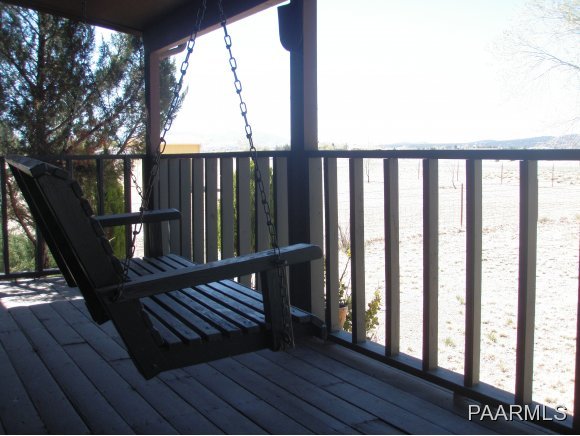 2895 North Reed Road, Unit 1 Chino Valley, AZ 86323 - Photo 3 of 22 a view of balcony with wooden floor and outdoor seating