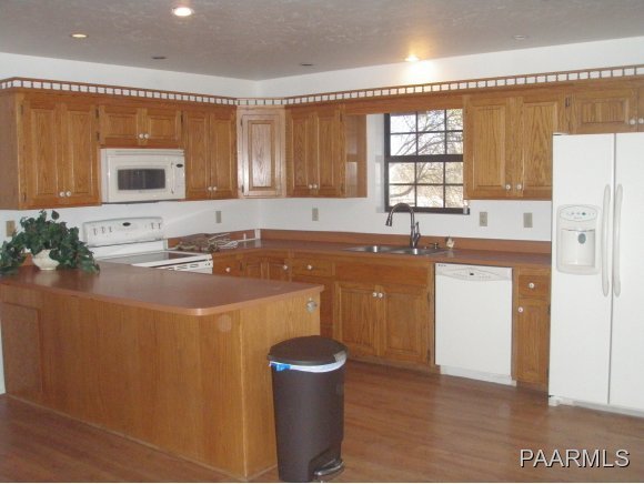 2895 North Reed Road, Unit 1 Chino Valley, AZ 86323 - Photo 7 of 22 a kitchen with a sink and a stove top oven
