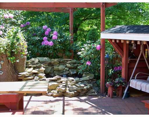 1526 Butler Road Springdale, PA 15144 - Photo 8 of 18 Patio/Deck. Side Patio with Water Feature