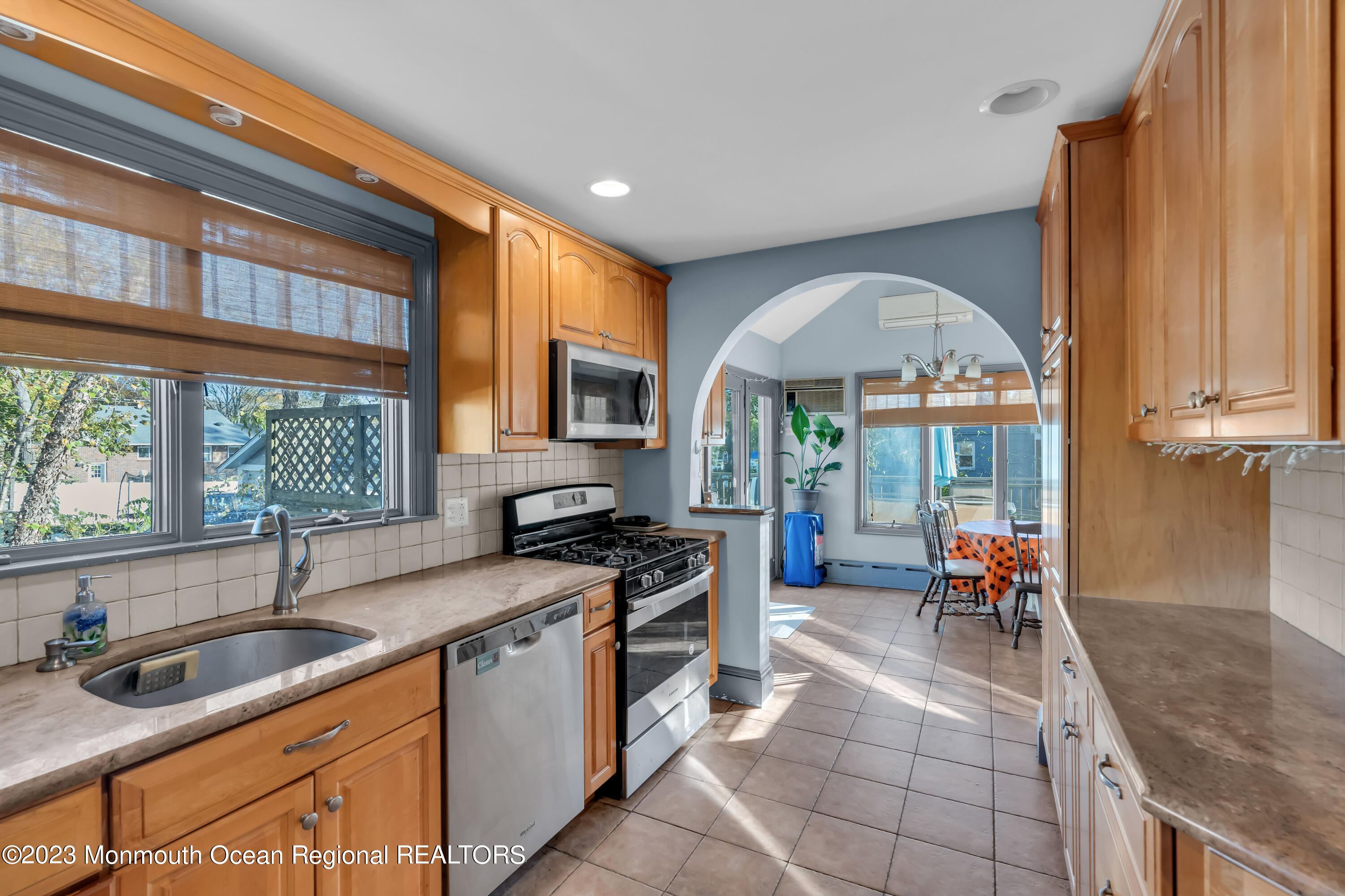225 Oakhurst Road Oakhurst, NJ 07755 - Photo 5 of 20 a kitchen with granite countertop a sink a counter top space appliances and cabinets