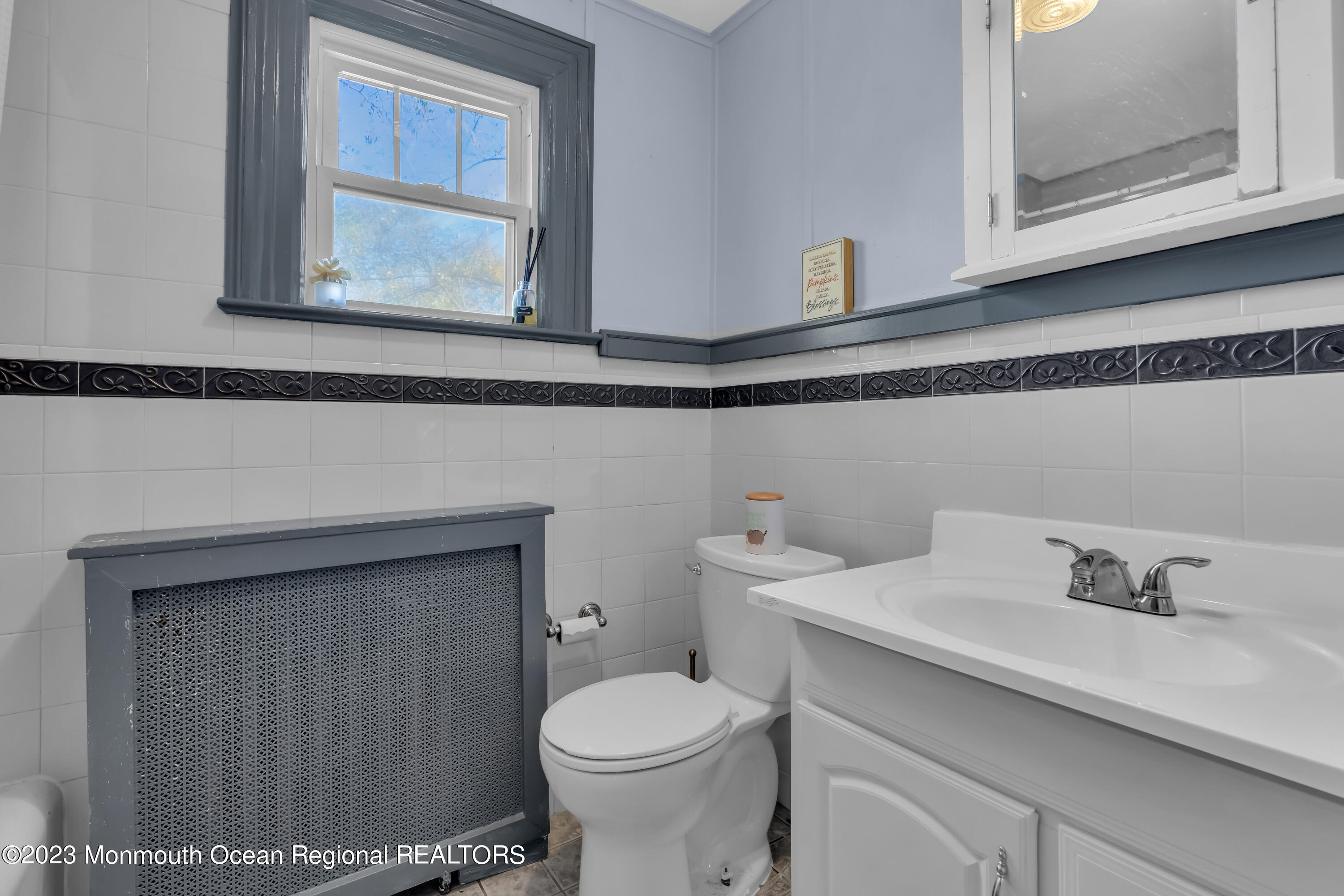 225 Oakhurst Road Oakhurst, NJ 07755 - Photo 9 of 20 a bathroom with a sink toilet and vanity