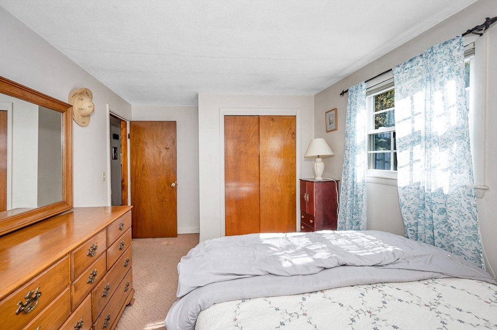 24 Arcadia Road Billerica, MA 01821 - Photo 11 of 24 a bedroom with a bed and a window