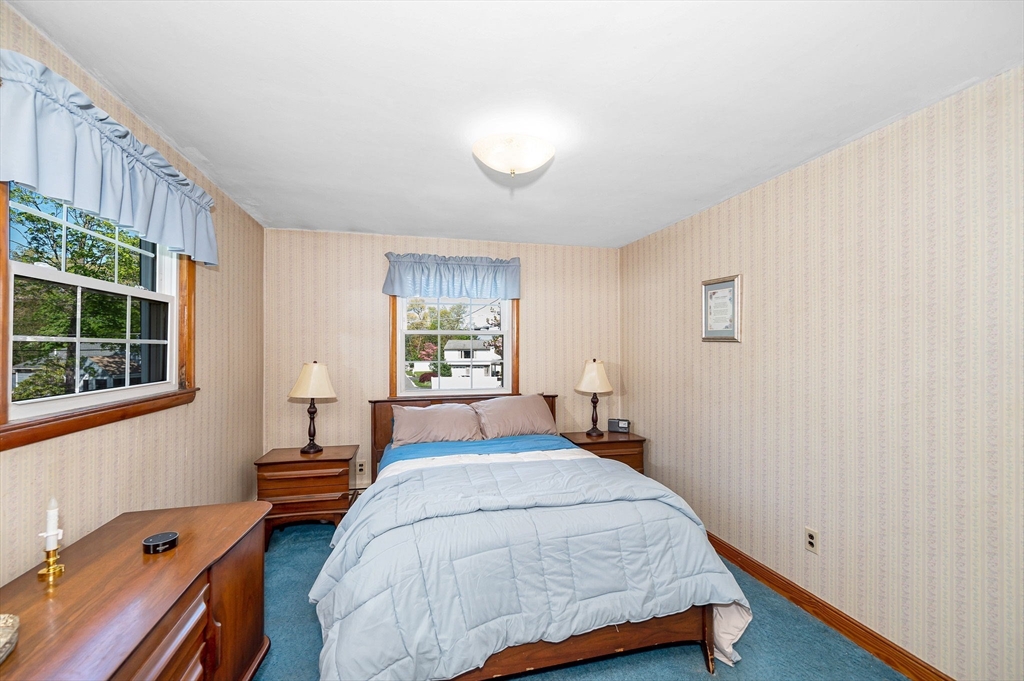 24 Arcadia Road Billerica, MA 01821 - Photo 13 of 24 a bedroom with a bed and a window