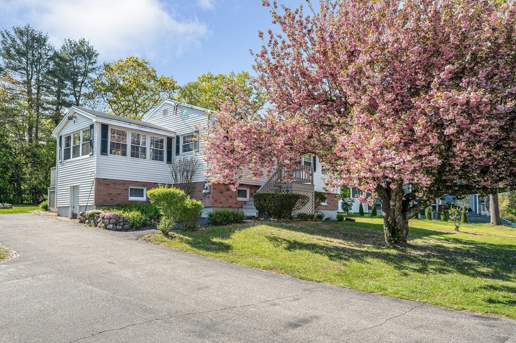 24 Arcadia Road Billerica, MA 01821 - Photo 3 of 24 a front view of a house with garden