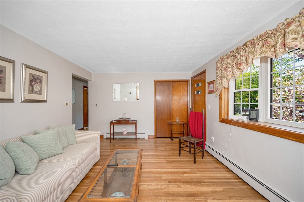 24 Arcadia Road Billerica, MA 01821 - Photo 8 of 24 a living room with furniture bathtub and a large window