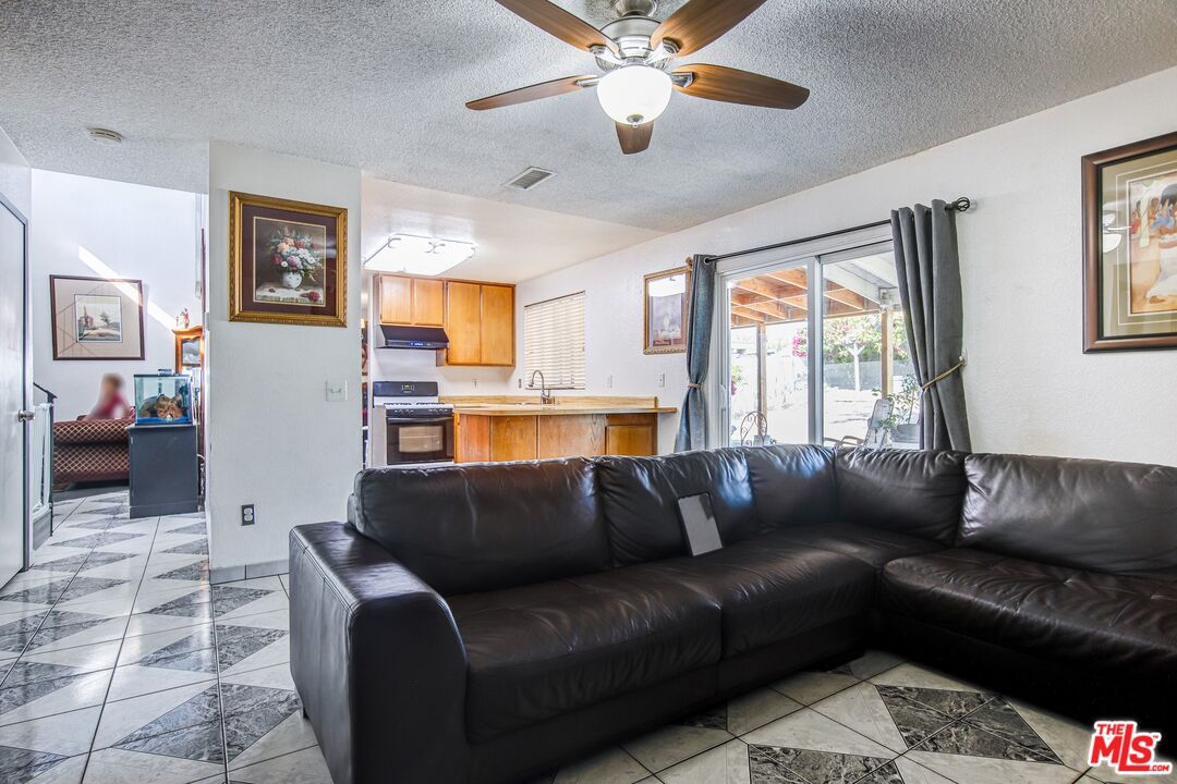 981 West Long Beach Drive Colton, CA 92324 - Photo 11 of 33 a living room with furniture and a window