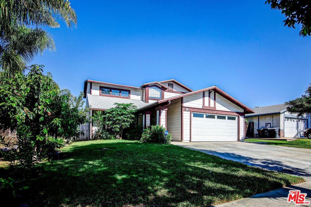 981 West Long Beach Drive Colton, CA 92324 - Photo 2 of 33 a front view of a house with a yard