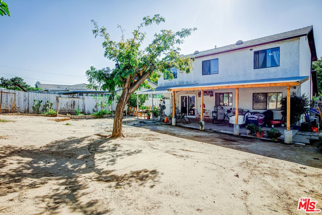 981 West Long Beach Drive Colton, CA 92324 - Photo 28 of 33 a view of street with shops and trees in the background