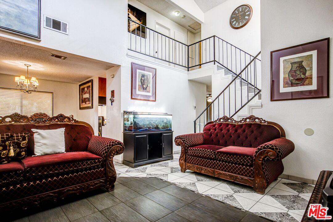 981 West Long Beach Drive Colton, CA 92324 - Photo 5 of 33 a living room with furniture ceiling fan and a rug