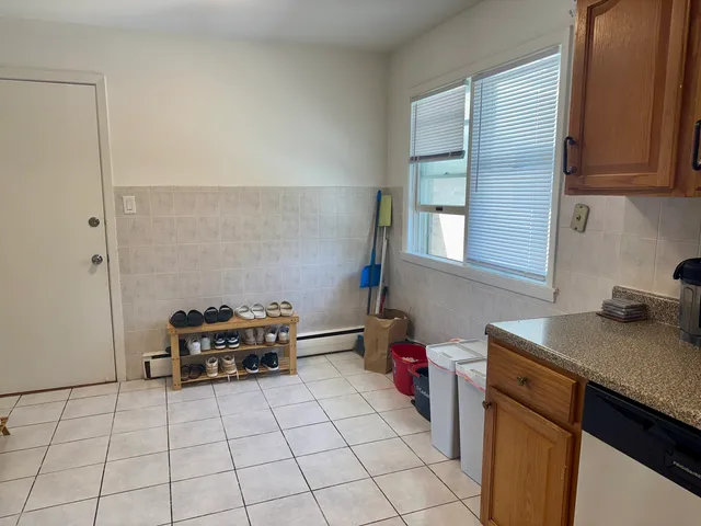 a kitchen with a sink a stove and a microwave