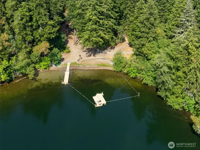 a backyard of a house with a yard lake view and green space