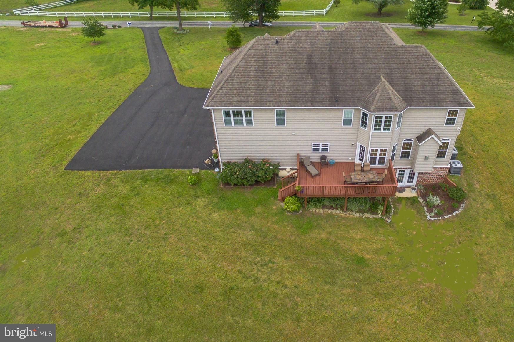 7420 Flint Hill Road Owings, MD 20736 - Photo 30 of 30 a aerial view of a house with a yard table and chairs