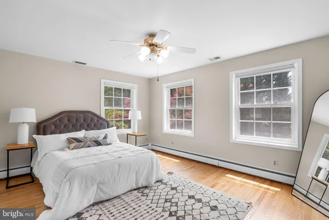 a bedroom with a large bed and a window