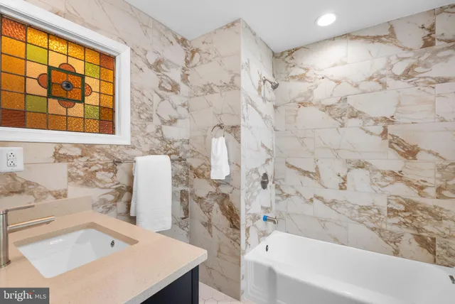 a bathroom with a sink and a bathtub