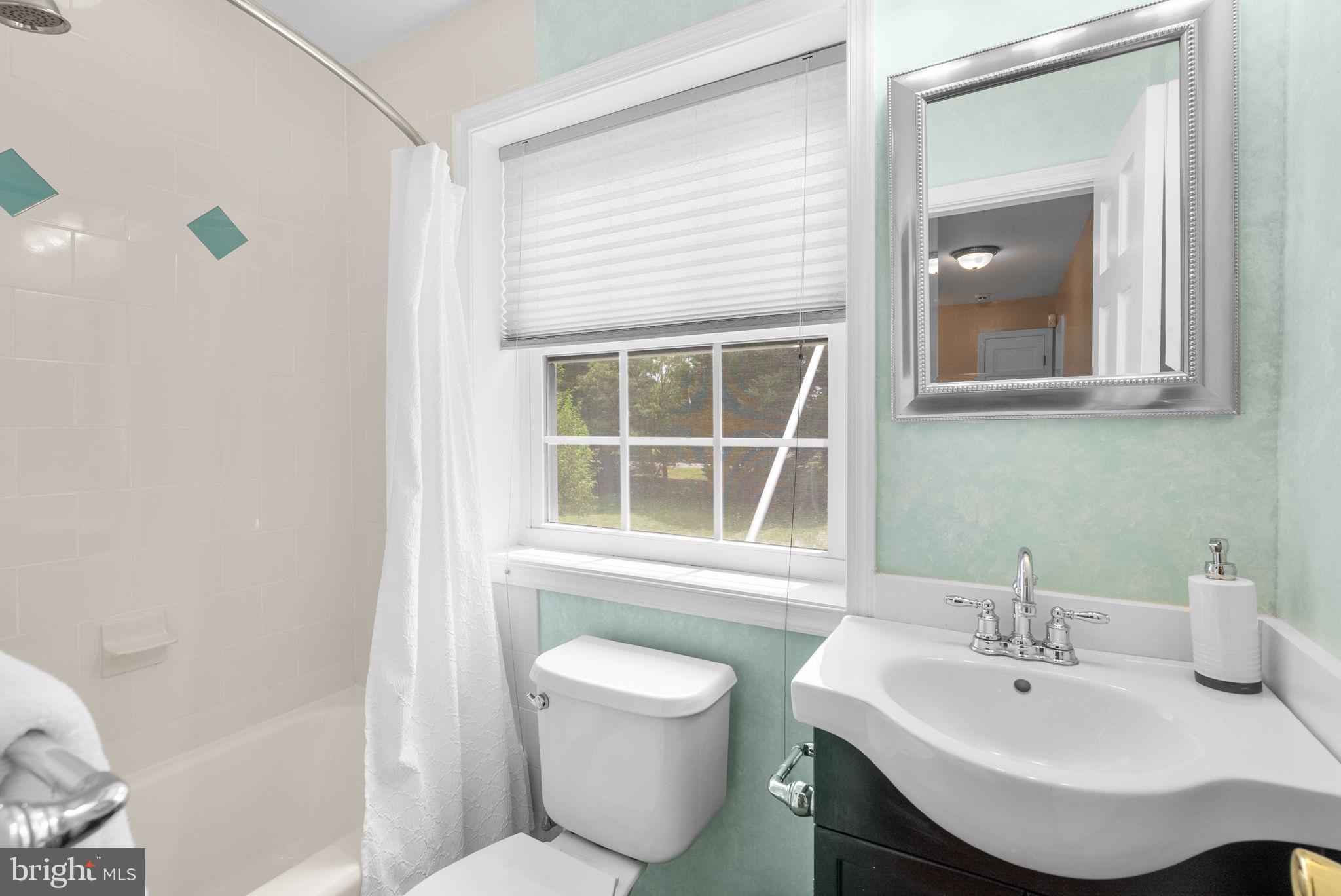 211 Olney Sandy Spring Road Ashton, MD 20861 - Photo 24 of 49 a bathroom with a sink and a mirror