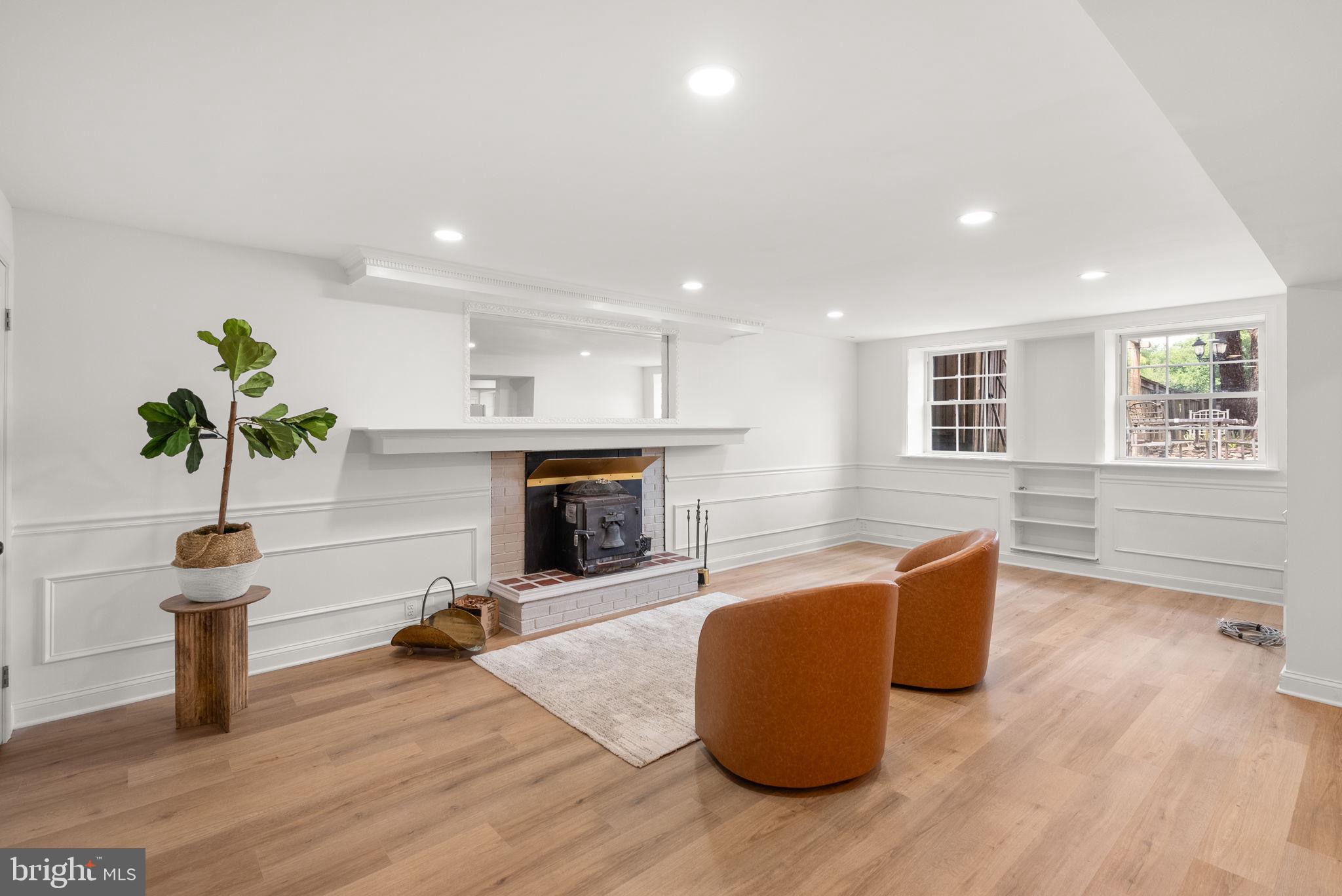 211 Olney Sandy Spring Road Ashton, MD 20861 - Photo 29 of 49 a living room with furniture and a fireplace