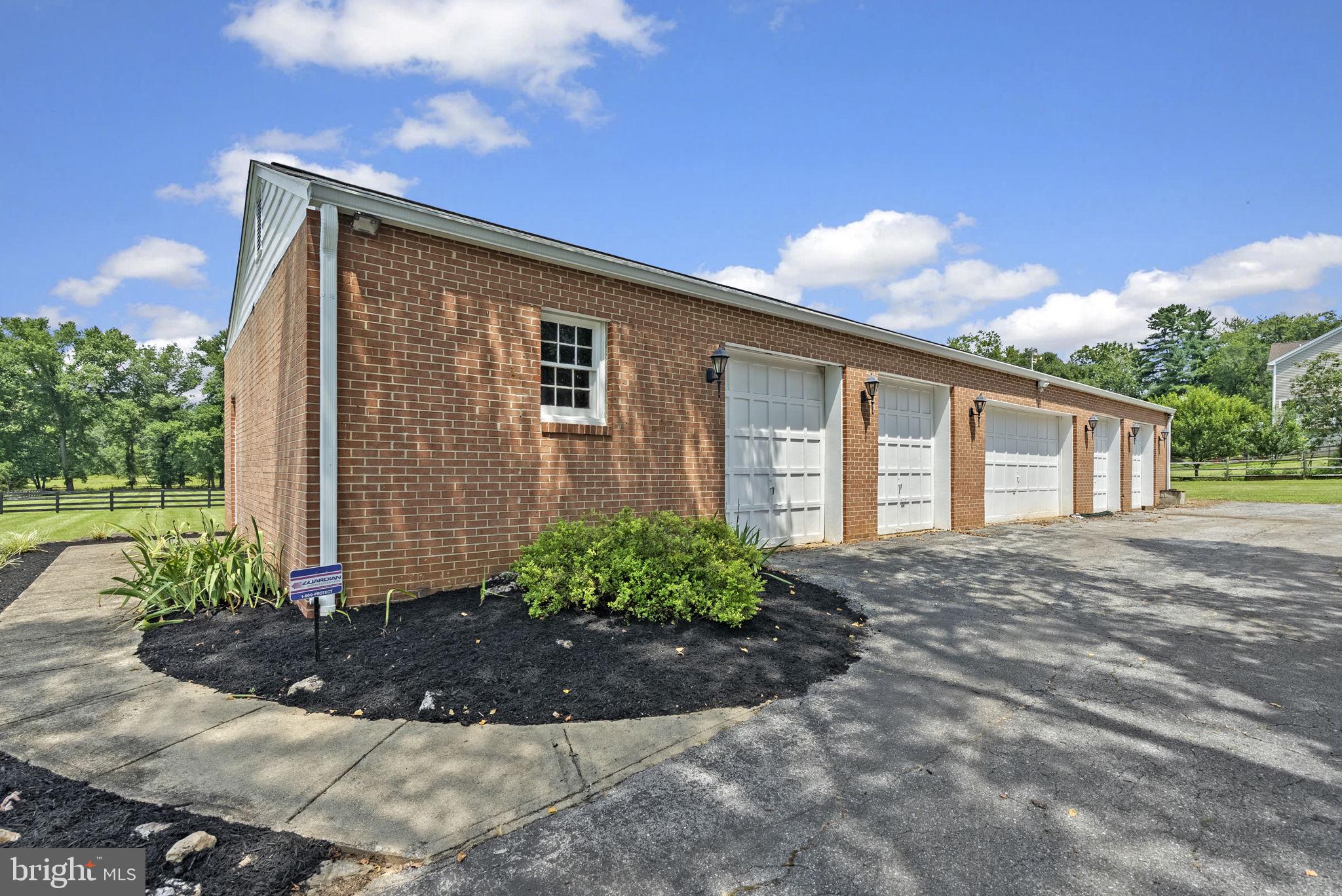 211 Olney Sandy Spring Road Ashton, MD 20861 - Photo 36 of 49 a front view of a house with garden