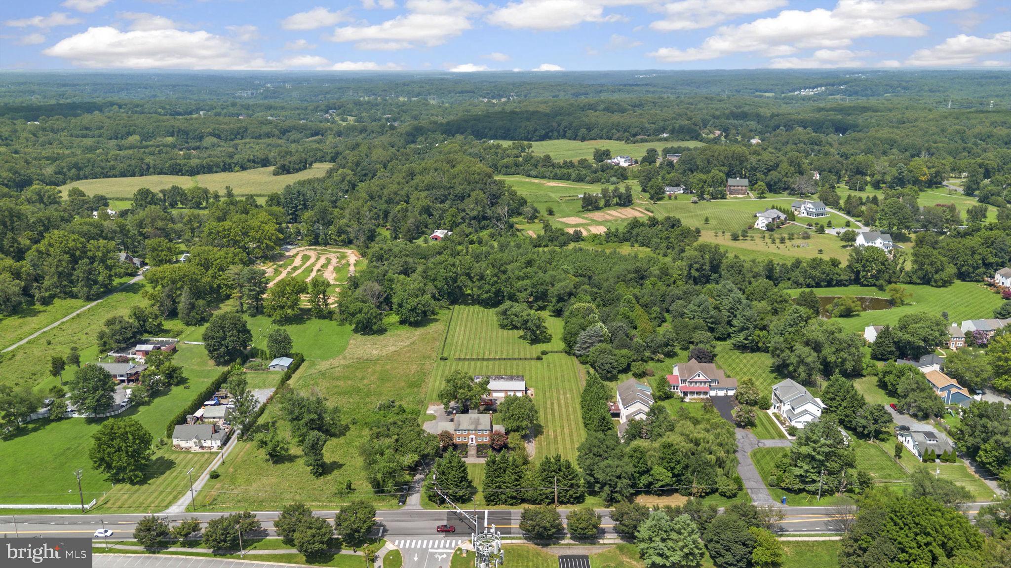 211 Olney Sandy Spring Road Ashton, MD 20861 - Photo 40 of 49 an aerial view of residential houses with outdoor space and trees