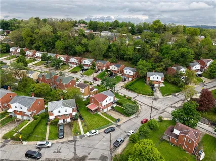 an aerial view of a house with a garden