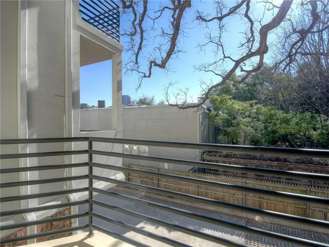 a view of a house with a tree