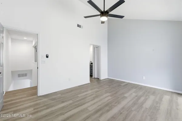 a view of an empty room with a window