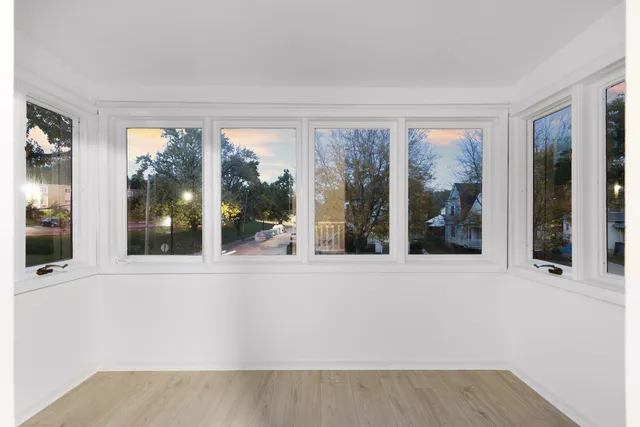 front view of a house with a large window