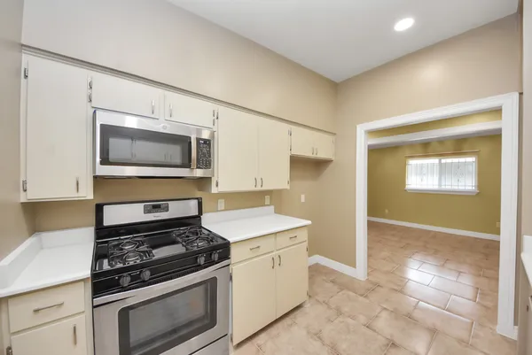 a kitchen with a sink and a refrigerator
