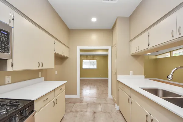 a kitchen with a sink and cabinets