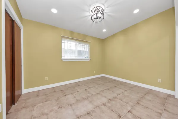 a view of a hallway with wooden shelves