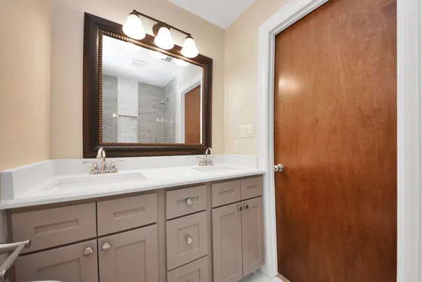 a bathroom with a bathtub and shower