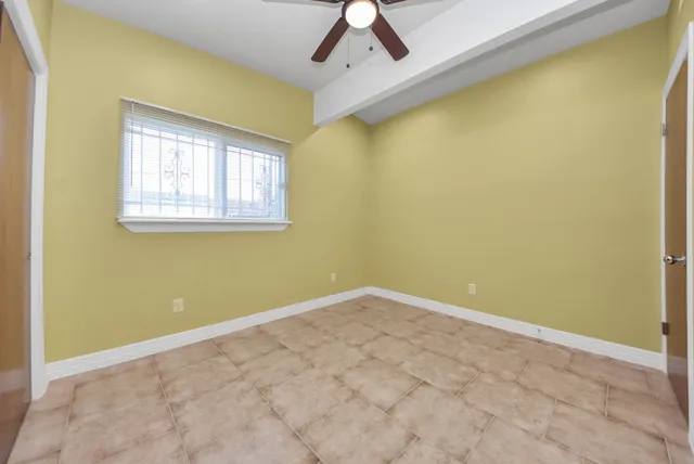 a bathroom with a sink a mirror a toilet and shower