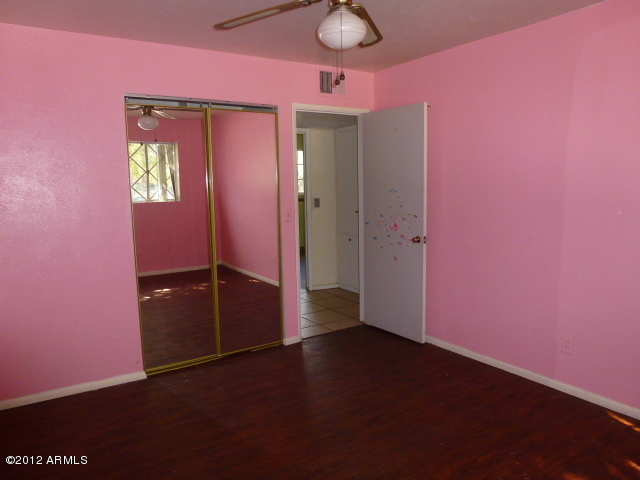 3032 West Bloomfield Road Phoenix, AZ 85029 - Photo 20 of 32 an empty room with windows and closet