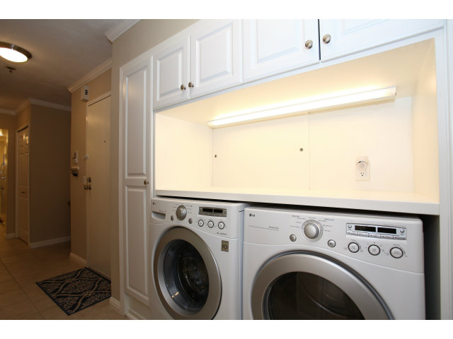 1115 Continentals Way, Unit 203 Belmont, CA 94002 - Photo 11 of 16 a utility room with dryer and washer