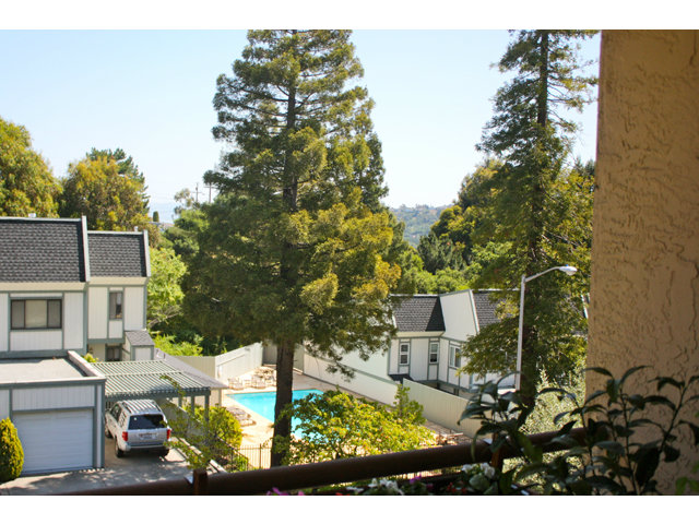 1115 Continentals Way, Unit 203 Belmont, CA 94002 - Photo 5 of 16 a view of house with yard