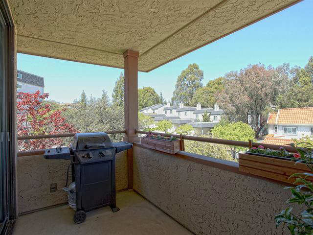 1115 Continentals Way, Unit 203 Belmont, CA 94002 - Photo 7 of 16 a view of a chairs and table in patio